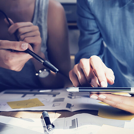 Image of two people planning a marketing strategy