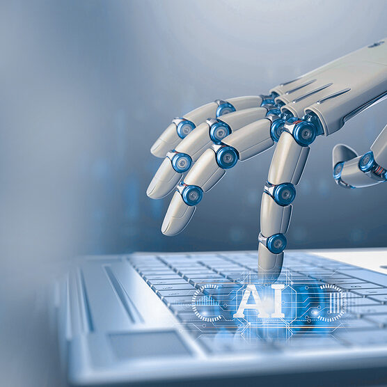 Image of robot using a computer